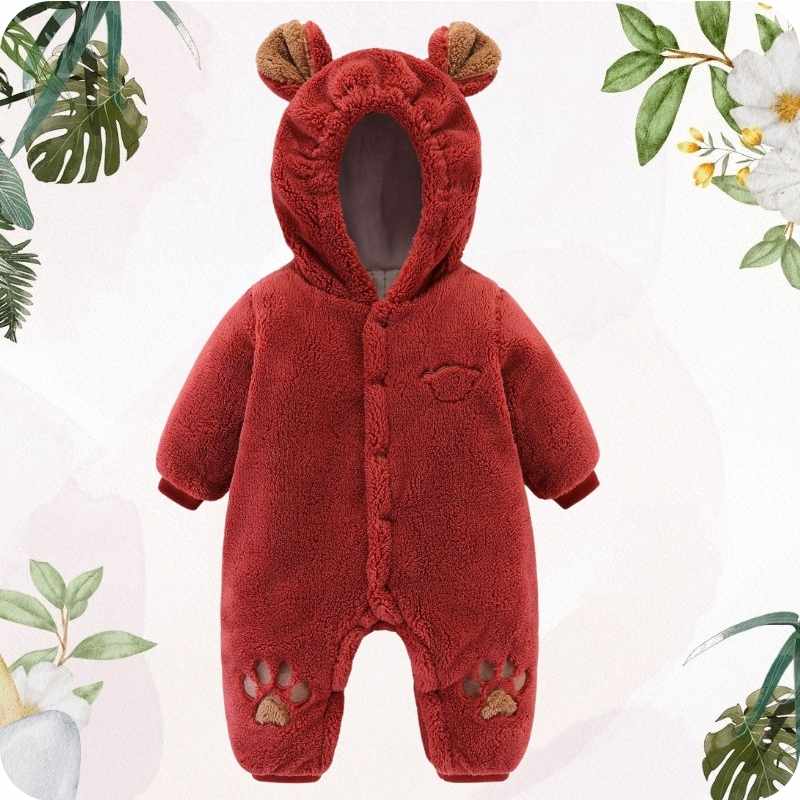 Red baby snowsuit with bear ears and paw prints on a white background with green leaves and flowers.