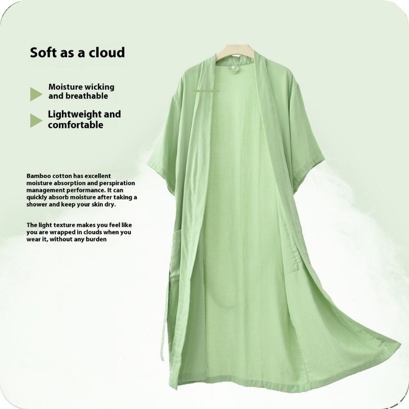 Light green kimono-style garment on a hanger with text about its properties.
