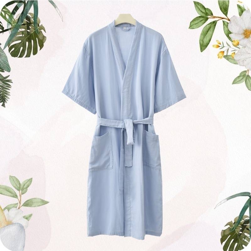 Light blue robe on a hanger with floral and leaf decorations