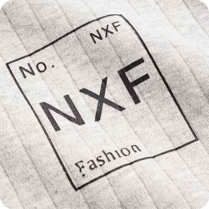 Text 'No. NXF Fashion' on a textured surface