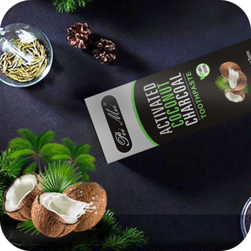 Natural ingredients of Enhanced Bamboo Activated Charcoal Natural Toothpaste—featuring organic activated bamboo charcoal, coconut oil, thyme oil, wheat germ, and cardamom for effective whitening and oral health