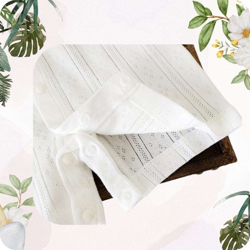 White lace fabric on a white background with floral and leaf decorations.