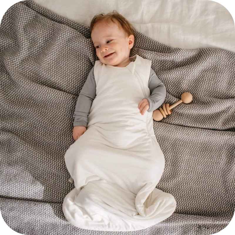 Showing a Baby in the White Bamboo Fiber Baby Sleeping Bag