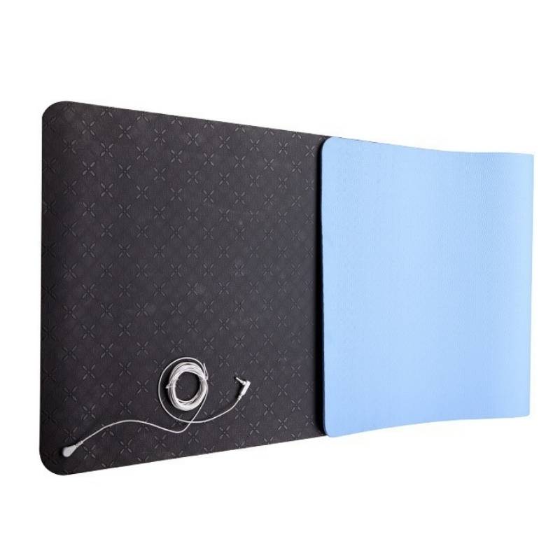 Close-up of the black and blue sides of a grounding mat, highlighting material contrast, durability, and conductive properties for wellness.