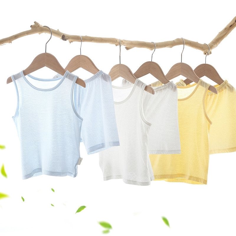 Showing a Collection of the Bamboo Fiber Toddler Vest Suits on Hangers