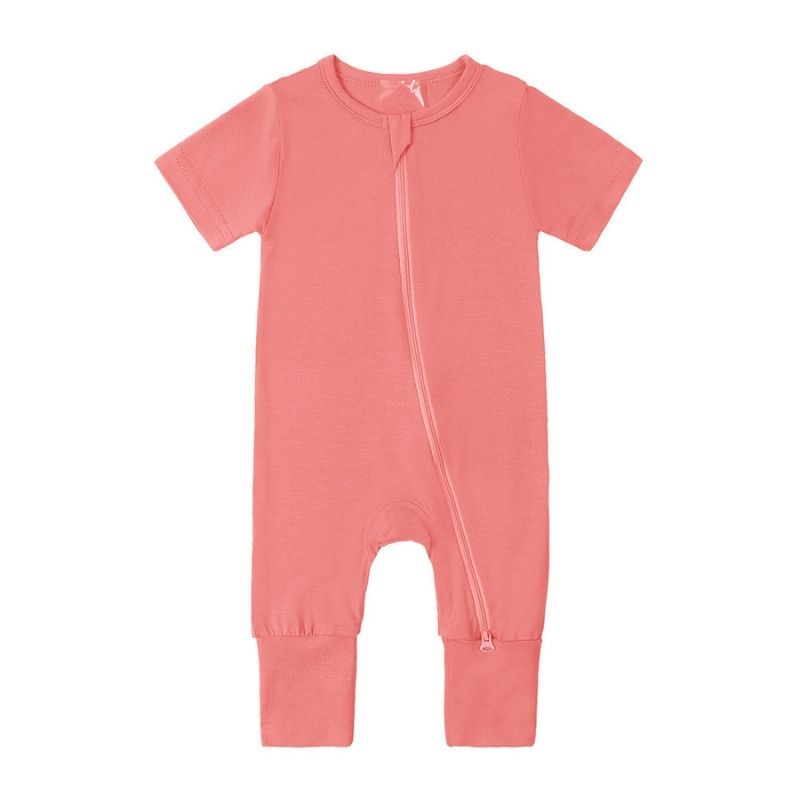 Coral pink bamboo baby jumpsuit with short sleeves—breathable, ultra-soft, and gentle for sensitive skin; displayed flat to show color warmth.