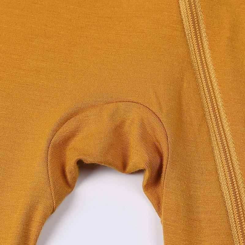 Close-up of a mustard yellow fabric with a white background