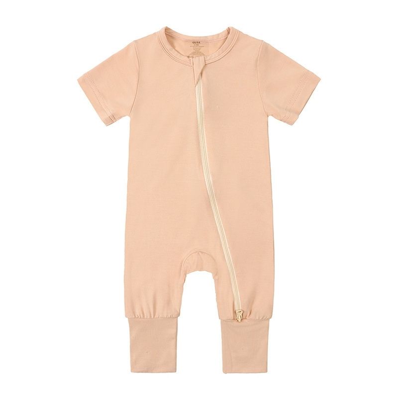 Ginger yellow bamboo baby jumpsuit with short sleeves—soft, breathable, and ideal for sensitive skin; shown laid flat for color clarity.