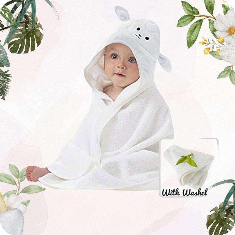 Baby wrapped in a white hooded towel with floral and leaf decorations
