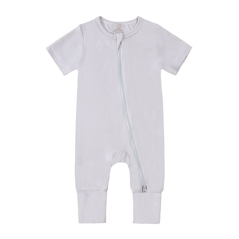 Light grey bamboo baby jumpsuit with short sleeves—soft, breathable, and gentle on sensitive skin; laid flat to show fabric texture and color.