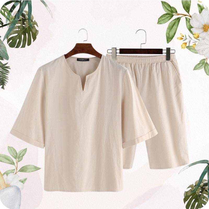 Beige shirt and shorts set on hangers with a light pink background and green leaf elements.