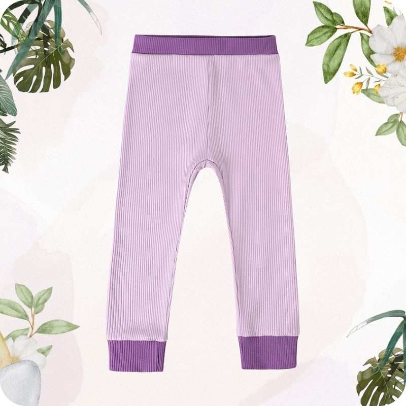 Purple ribbed leggings on a light pink background with green leaves and flowers.