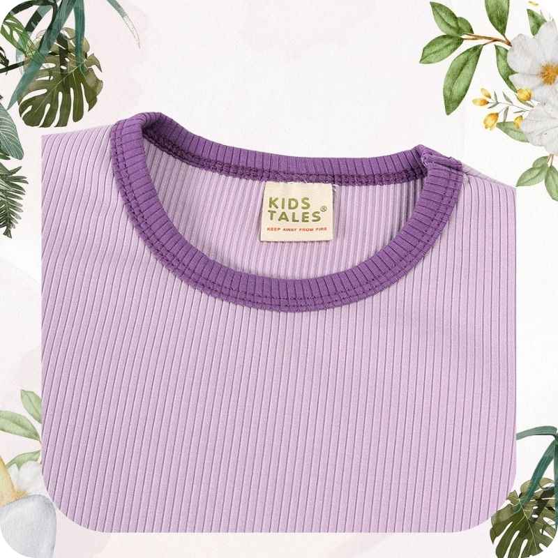 Purple ribbed top with a 'Kids Tales' label on a white background with floral and leaf decorations.