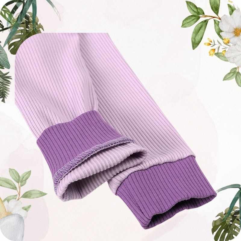 Purple ribbed sleeves on a white background with green foliage.