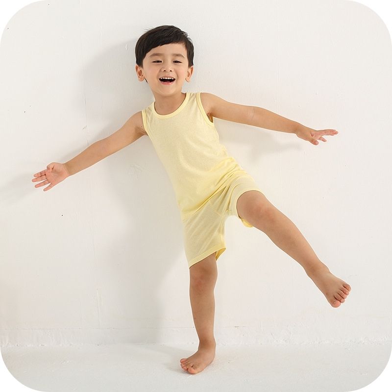 Showing a boy wearing the Bamboo Fiber Toddler Vest Suit