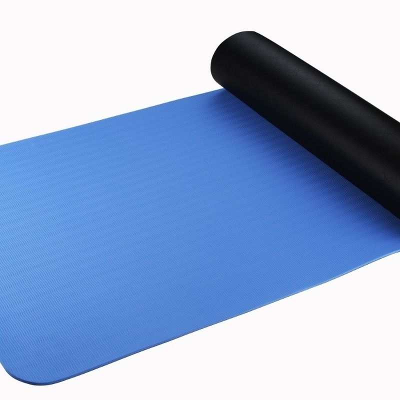 Close-up of the blue and black sides of a grounding mat, highlighting material contrast, durability, and conductive properties for wellness.