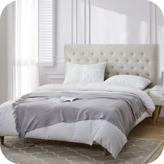 A memory foam pillow with a bamboo fiber cover, displayed on a bed in a room with a light interior.