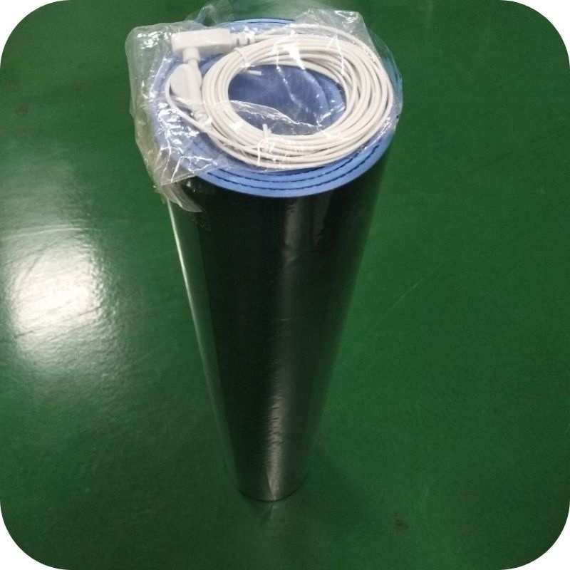 Rolled-up grounding mat with blue surface visible, highlighting its flexible design, durability, and conductive properties for wellness.